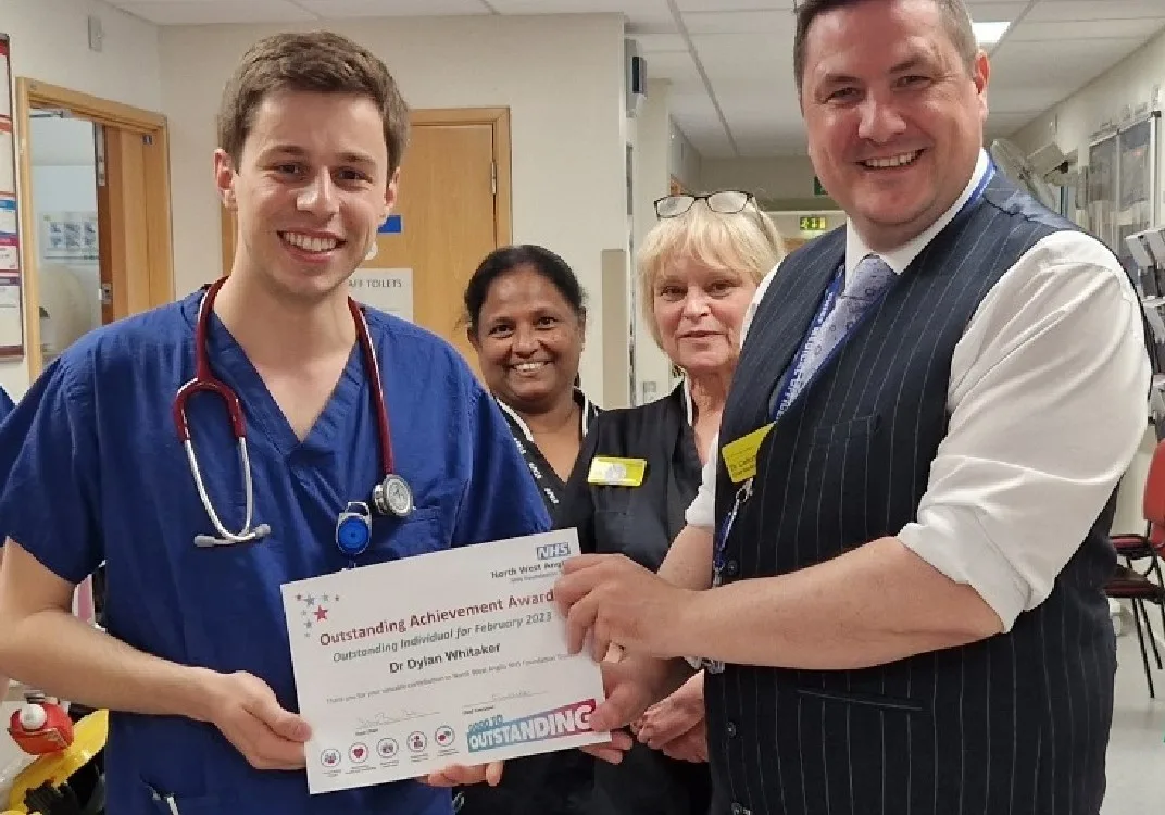 North West Anglia NHS Foundation Trust Chief Medical Officer, Dr Callum Gardner presents Dr Dylan Whitaker (left) with his Outstanding Individual of the Month certificate.